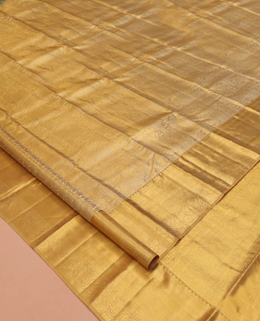 Gold Kanchipuram Tissue Silk Saree, Opulently Embellished with Jacquard Designs on Its Body, Highlighted by a Zari Border of Traditional Designs, Intricately Designed Pallu, and Paired with a Matching Blouse