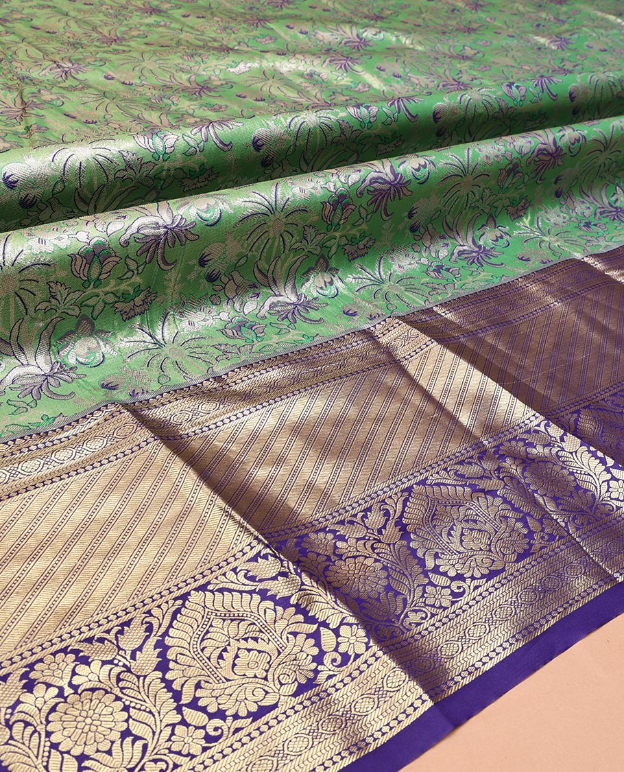 Green Art Silk Half-Saree, Spotlighted with Jacquard Design, Contrast Traditional Zari Border, Paired with a Contrast Jacquard Blouse, and an Intricate Dhavani