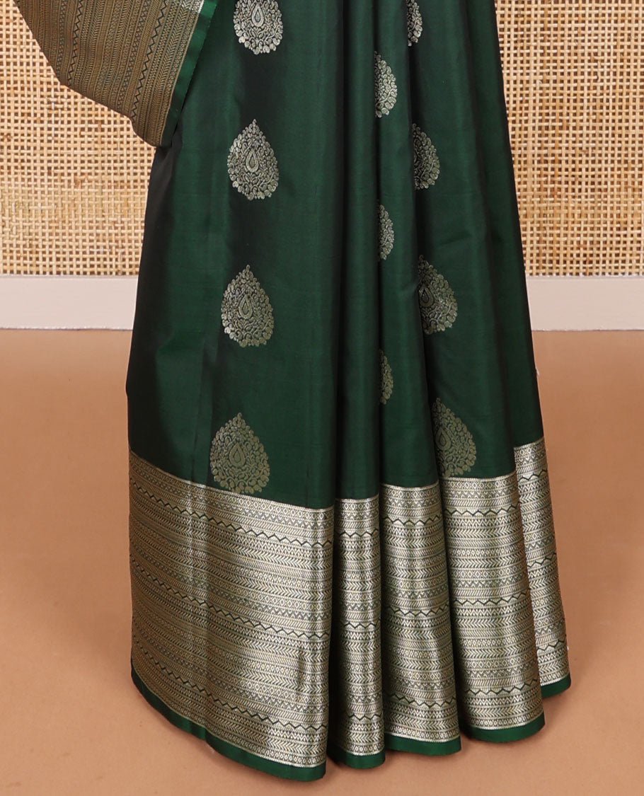 Dark green leaf buttas vasundhara elite silk saree with self intricate zari design border & floral vine design pallu