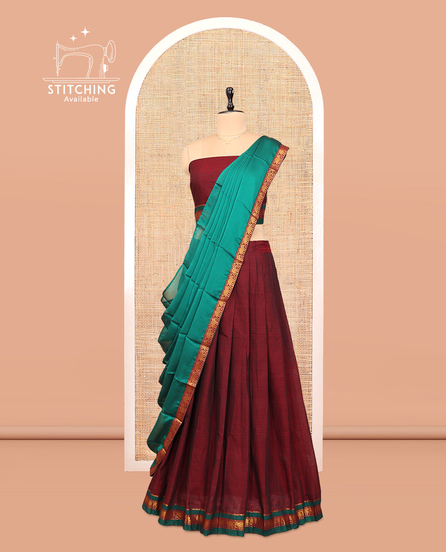 Maroon Cotton Half-Saree Features Plain Skirt, a Contrast Traditional Zari Border, a Matching Blouse, and a Contrast Dhavani