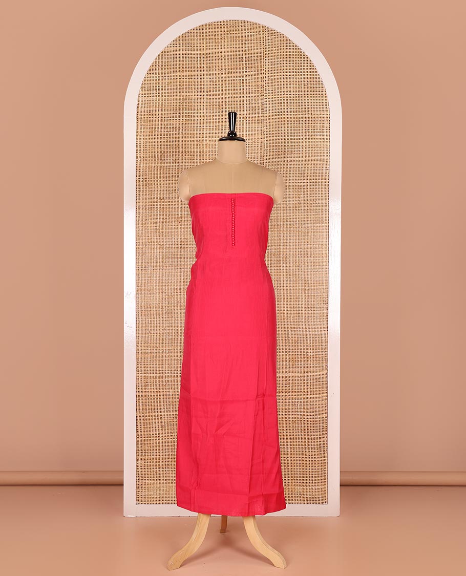 Pink material chudidar set, plain with pom-pom tasseled mul chanderi top, a matching bottom, and organza dupatta of stripes