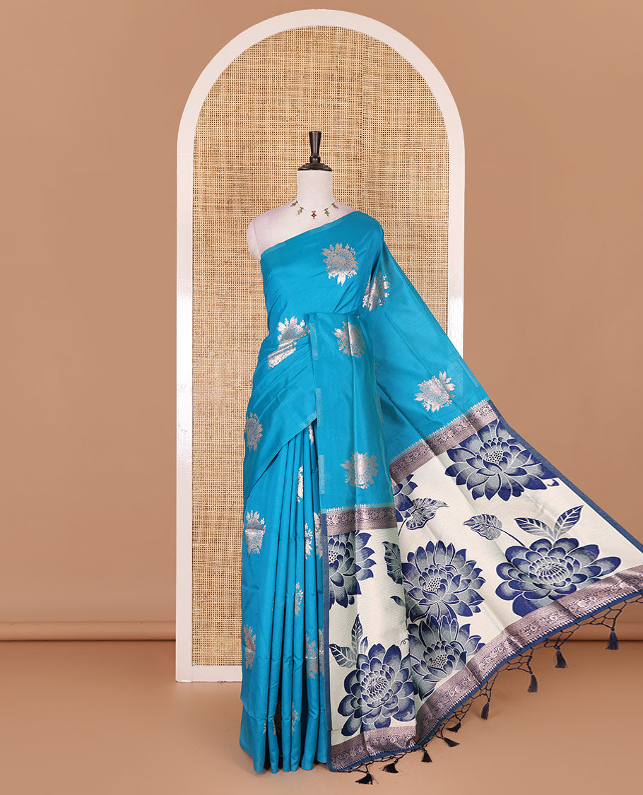 Borderless blue floral motifs steeped elite soft silk saree, contrast lotus-like motifs pallu, and contrast buttas blouse