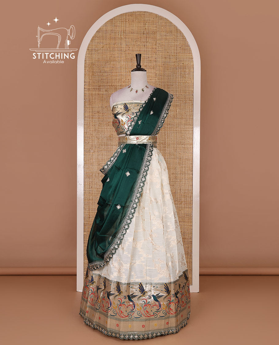 Cream banaras halfsaree, jaal jacquard skirt, contrast peacock green paithani border, matching blouse, and Syska georgette embroidered dhavani
