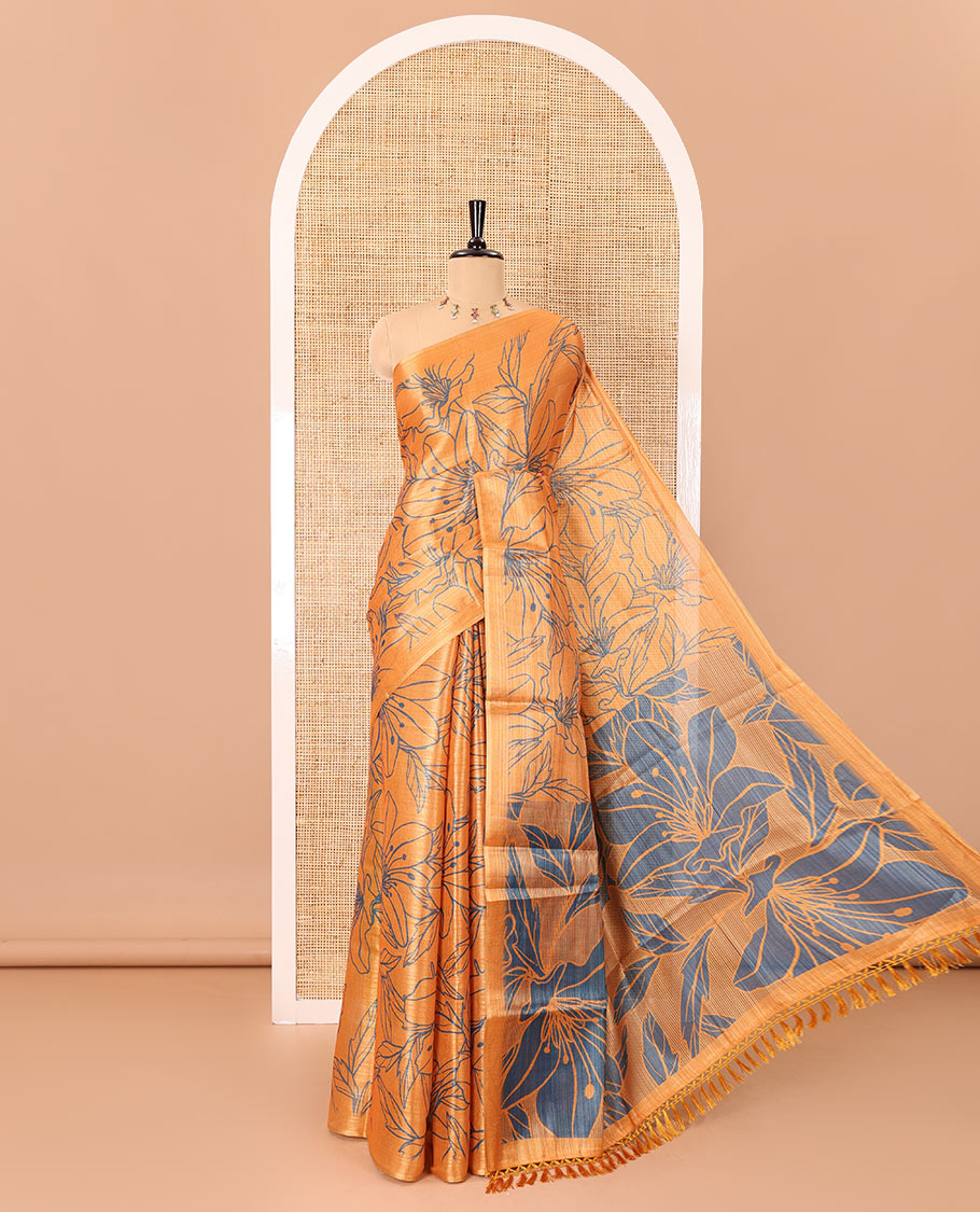 Borderless orange big floral motifs printed tissue silk saree with floral printed pallu, and a contrast plain blouse