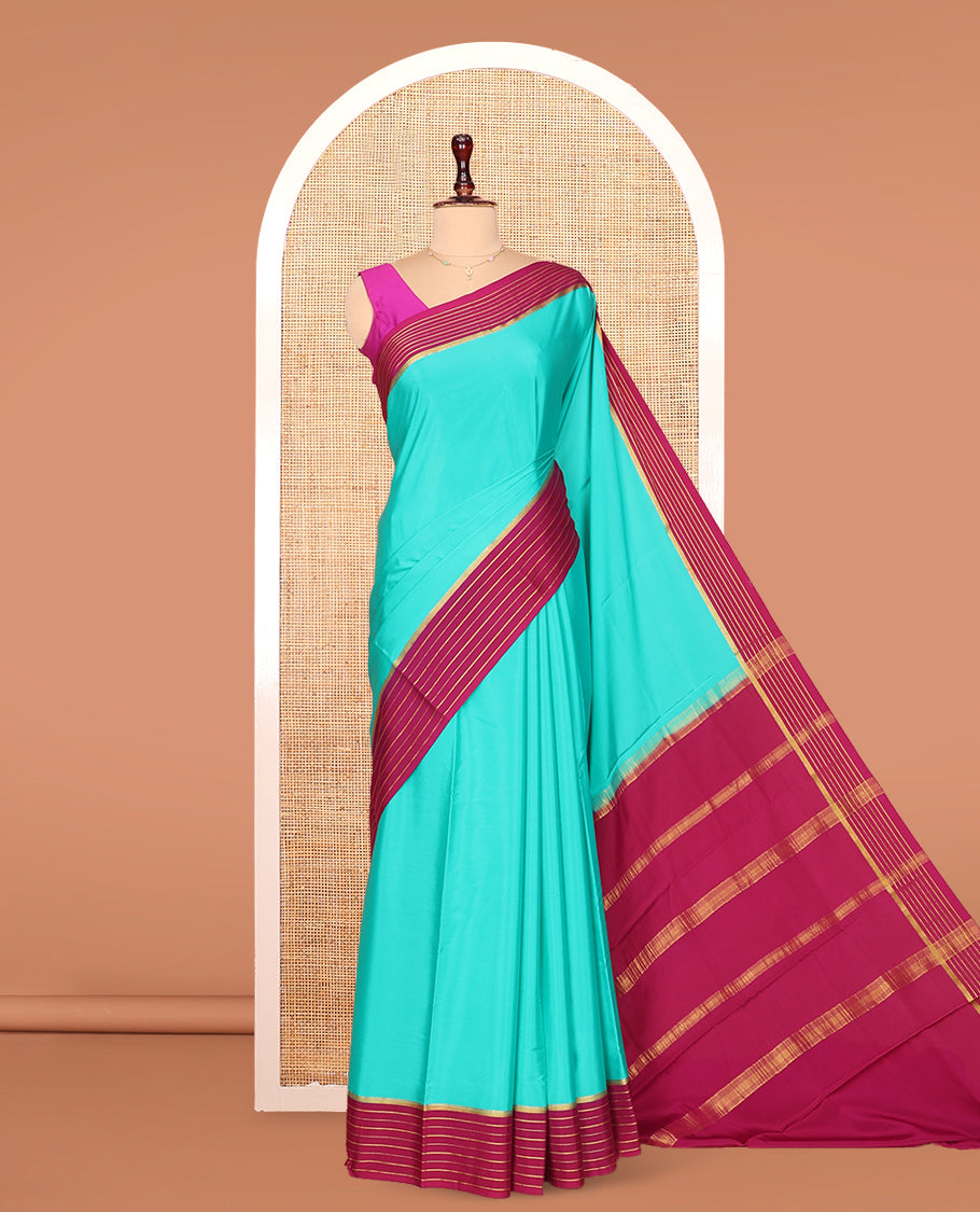 Green Plain Mysore Silk Saree, Complemented by Captivating Contrast Zari Striped Border, Pallu of Vibrant Zari Stripes and Paired with a Contrast Blouse