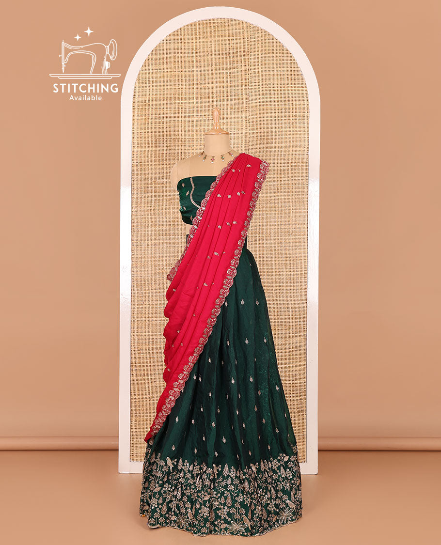 Green half-saree, floral and bird motifs embroidered velvet organza top, matching embroidered blouse, and contrast scallop embroidered syska georgette dhavani