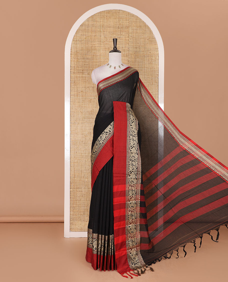 Black plain mercerised cotton saree, contrast traditional border of peacock, and elephant motifs, striped pallu, and a matching blouse