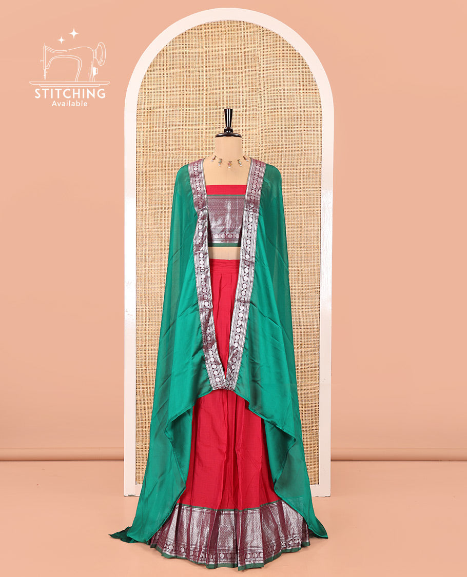 Tomato Red-Green Mercerised Cotton Half-Saree Features Plain with Contrast Traditional Zari Bordered Skirt, Paired with a Matching Blouse, and Comes with a Contrast Bordered Dhavani
