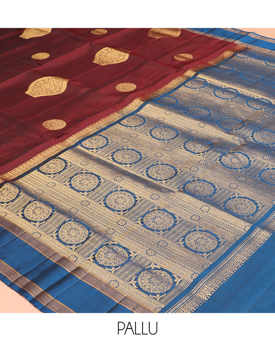 Maroon Mayuri Lite Silk Mix Saree, Gracefully Embellished with Zari Buttas, a Contrast Zari Border, Intricate Pallu, and a Contrast Blouse