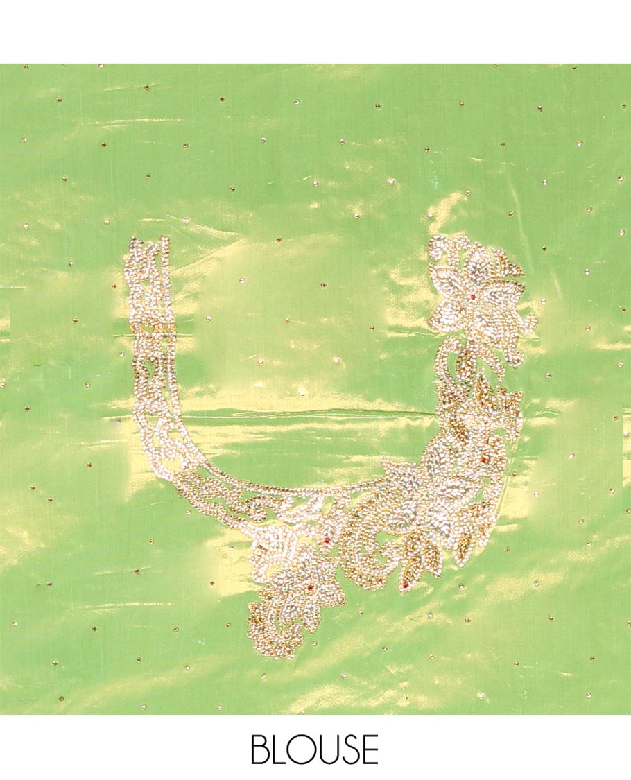 Green Vastrakala Silk Saree Highlighted with Floral Jacquard and Stone Work, Complemented by Contrast Traditional Zari and Stone Embroidered Scallop Border, Pallu Features Jaal Design and Stone Work, and Paired with Contrast Stone Embroidered Blouse