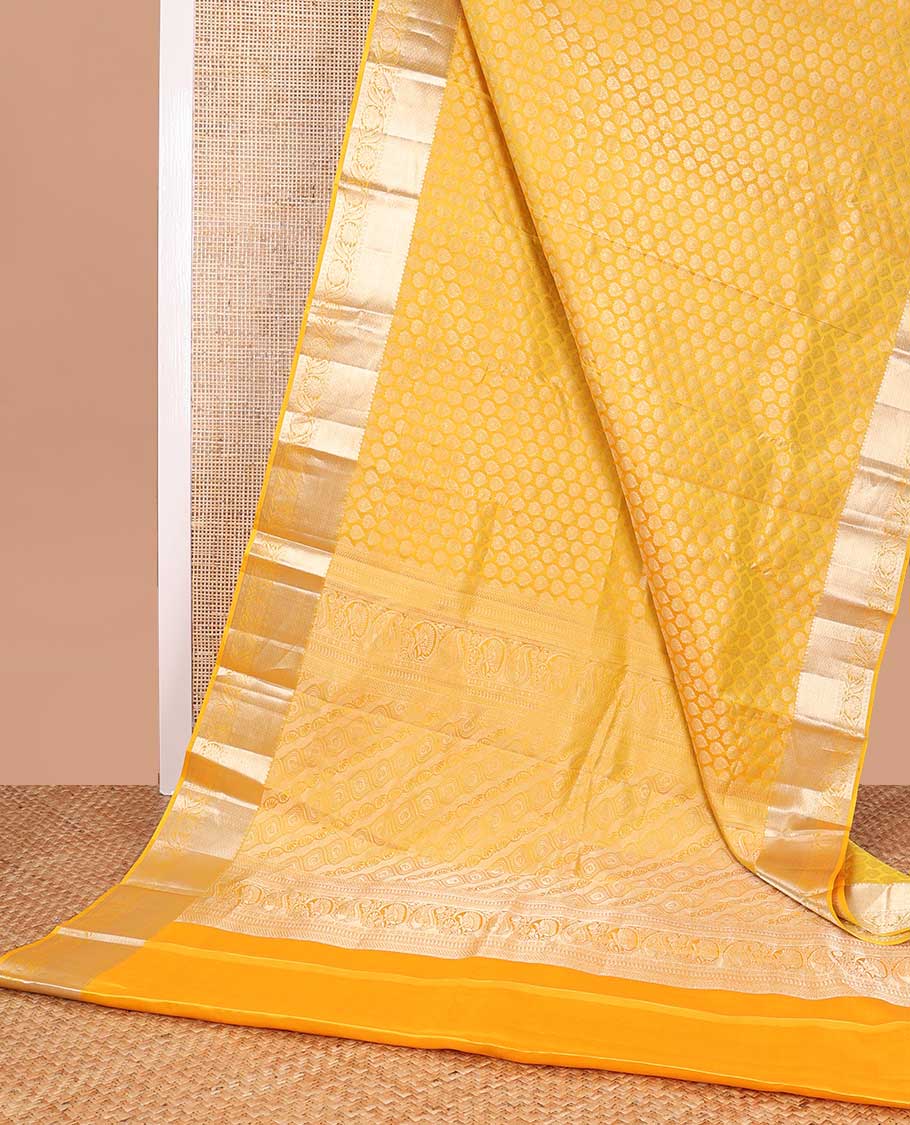 Yellow buttas kancheepuram silk saree with self border of intricate zari design border & floral design pallu