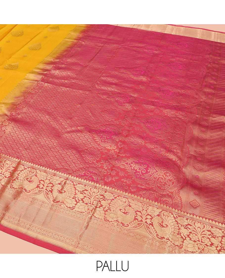 Yellow Vasundhara Lite Silk Mix Saree, Adorned with Zari Buttas All Over Its Body, Complemented by a Contrast Border of Thilakam Mokku, Muthu, Mayil, Kamalam, and Mayil Kann Designs, Gracefully Embellished Pallu, and Paired with a Contrast Blouse