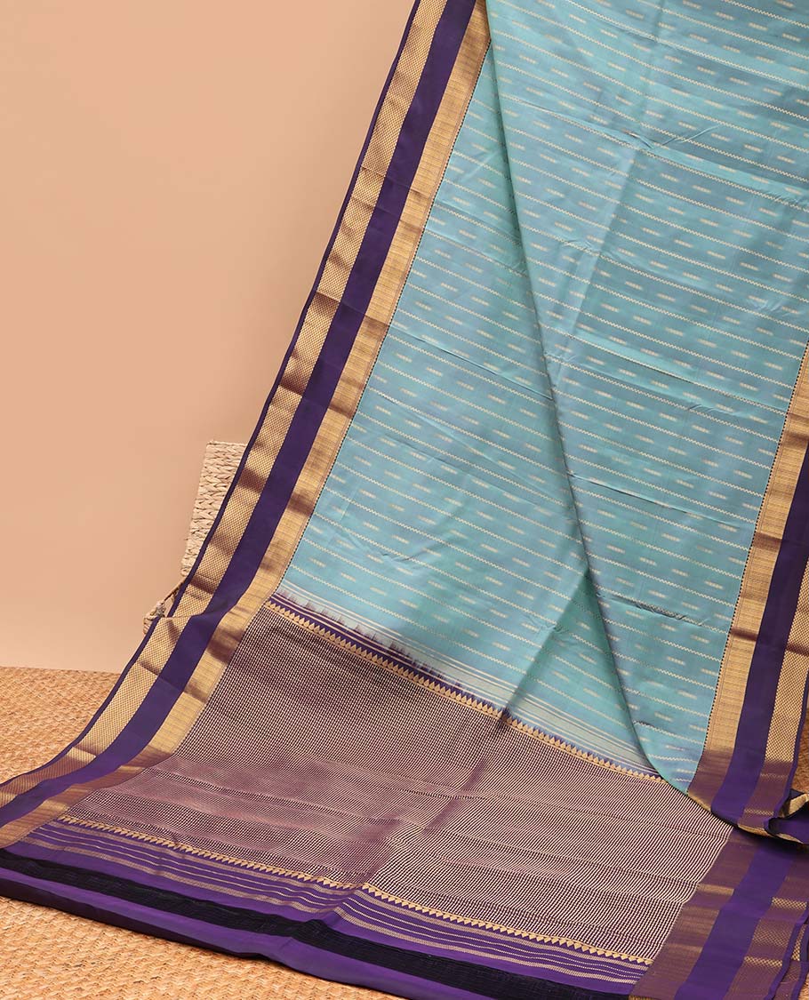 Light blue striped design vasundhara elite silk saree with contrast rettai pettu zari design border & intricate zari design pallu