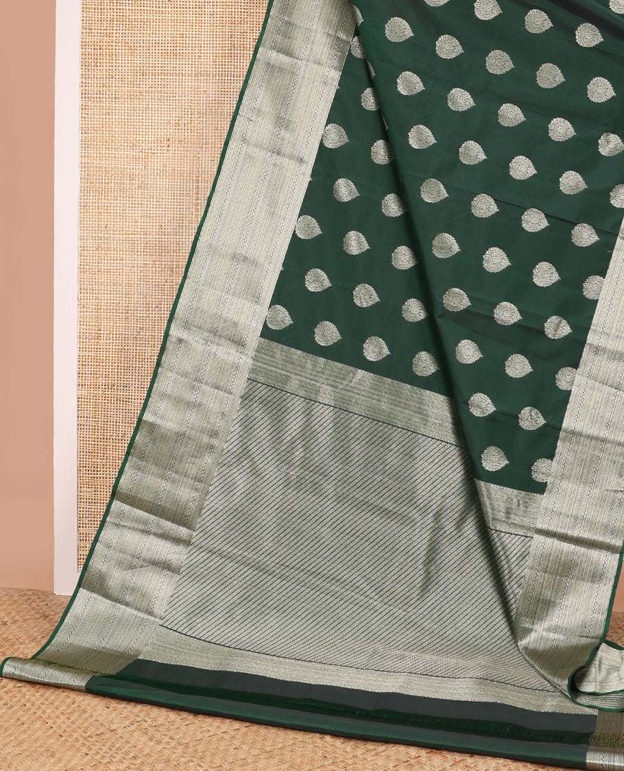 Dark green leaf buttas vasundhara elite silk saree with self intricate zari design border & floral vine design pallu