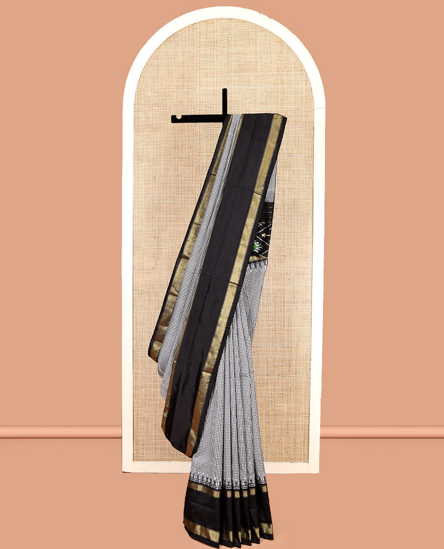 Black-White Micro-Checked Pochampally Ikat Silk Saree, Complemented by a Contrast Zari Cuckoo Bird-Eye Border, Ikat Jaal Pallu, and a Contrast Blouse