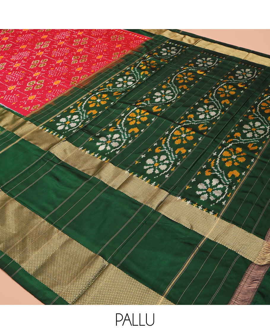 Red Ikkat Silk Saree, Ornamented with Ikkat Buttas Enclosed Checks All Over Its Body, Complemented by a Contrast Border of Floral Creeper Ikkat and Diamond Zari Designs, Pallu of Floral Creeper Designs, and Paired with a Matching Blouse