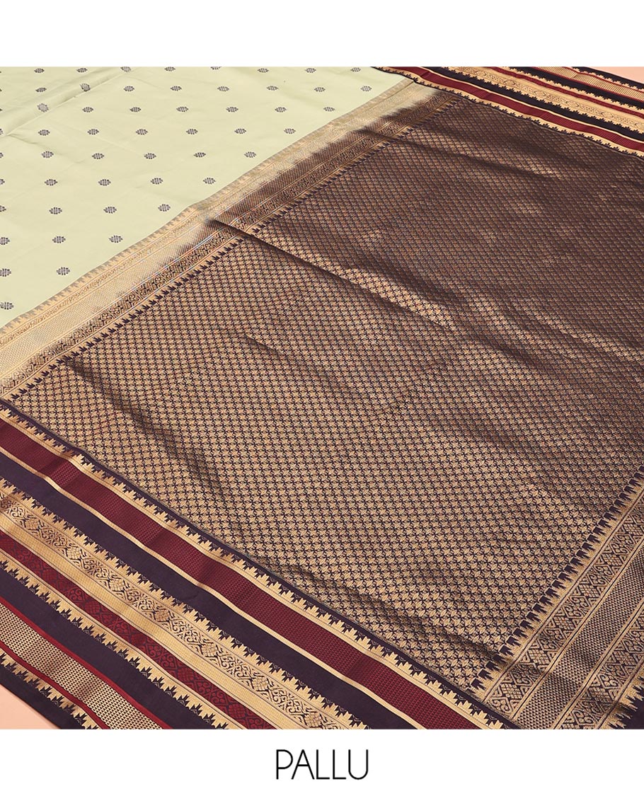 Pista Green and Coffee Brown Vasundenhara Lite Silk Mix Saree, Subtly Adorned with Buttas All Over Its Body, Complemted by Contrast Border of Thazampoo Rekku, Banaras, Jada Nagam, and Ara Maadam Designs, Grand Pallu, and Paired with a Contrast Blouse
