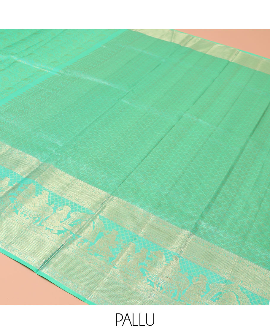 Turquoise Kanchipuram Wedding Silk Saree, Opulently Embellished with Floral Jaal Jacquard Design on Its Body, Highlighted by Zari Border of Diamond, Kuyil Kann, and Wedding-Theme Designs, Grand Jaal Pallu, and Paired with a Matching Blouse