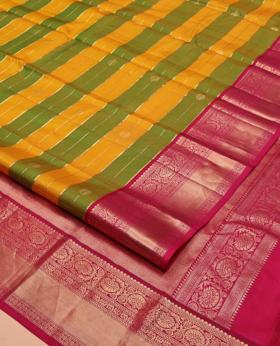 Green-Yellow Vasundhara Silk Saree, Embellished with Zari Buttas and Zari Stripes All Over Its Body, Complemented by a Contrast Border of Thilakam Mokku, Banaras, Muthu, and Kodi Visiry Designs, Pallu of Vanki Designs, and Paired with a Contrast Blouse