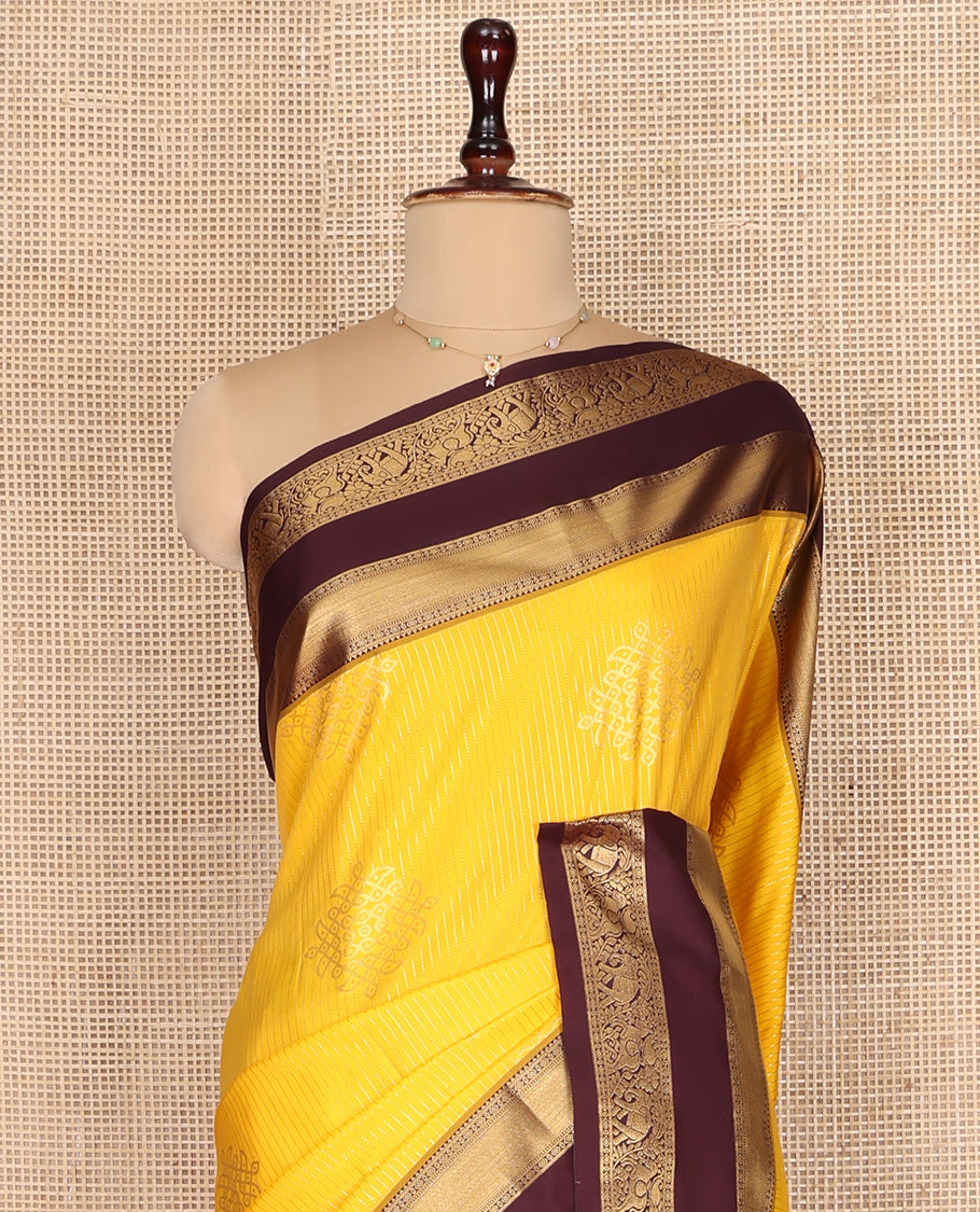 Yellow Budget Silk Saree, Embellished with Zari Stripes and Kolam Buttas All Over Its Body, Complemented by a Contrast Traditional Zari Design Rettai Pettu Border, Grand Scallop Design Pallu, and Paired with a Contrast Blouse