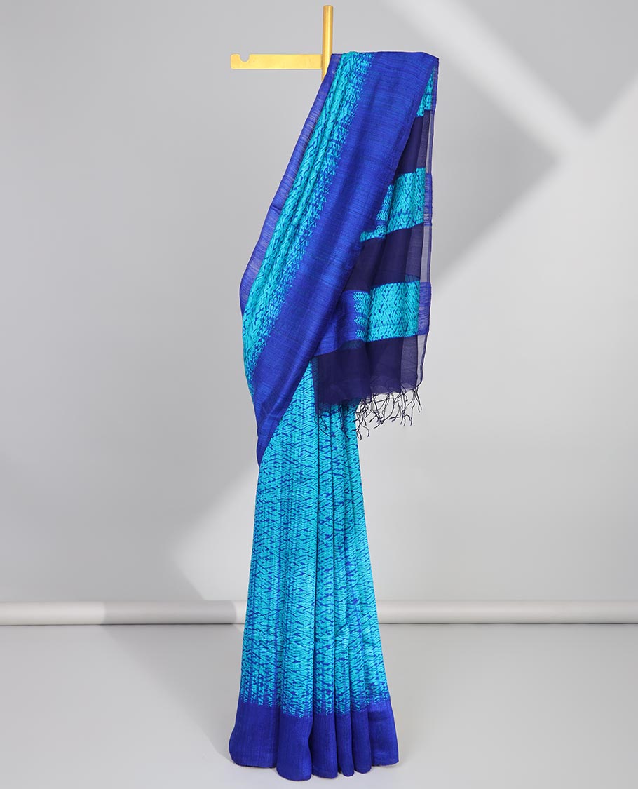 Blue abstract design matka silk saree with contrast plain border & blue abstract design pallu