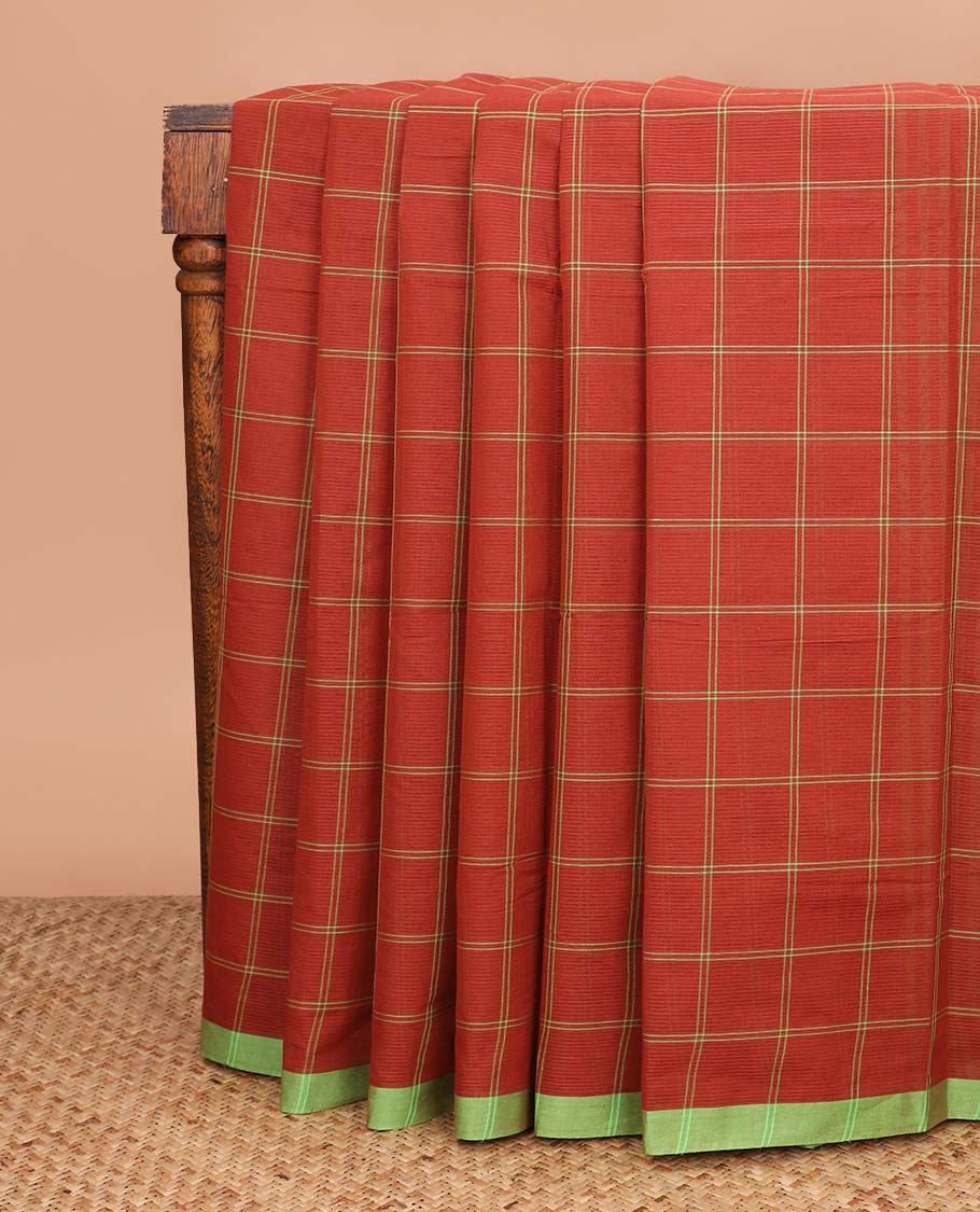 Rust orange checked Mangalagiri cotton saree, contrast striped border, striped pallu, and a contrast floral printed blouse