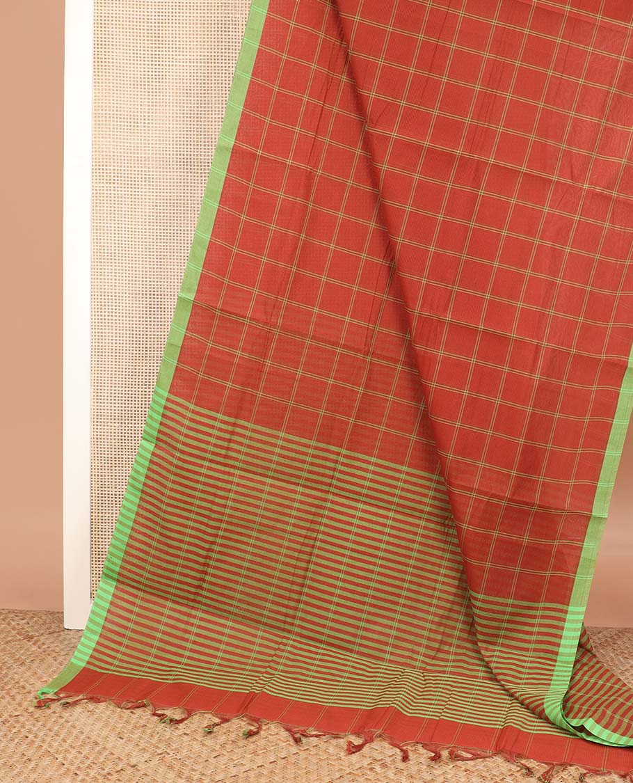 Rust orange checked Mangalagiri cotton saree, contrast striped border, striped pallu, and a contrast floral printed blouse