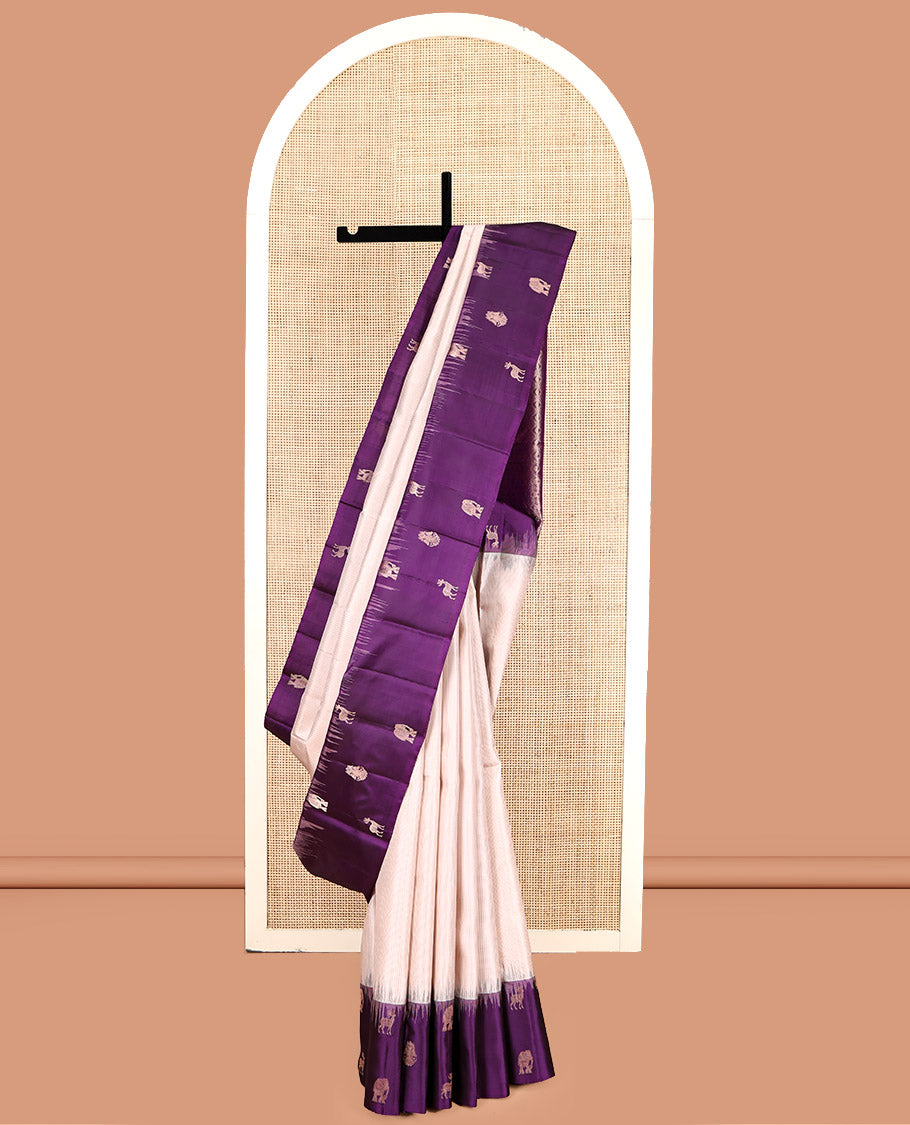 Off-White Kanchipuram Silk Saree, Sparsely Woven with Stripes, Complemented by a Contrast Border Features Yaanai, Maan, and Iruthalai Pakshi, Jaal Pallu, and a Contrast Blouse