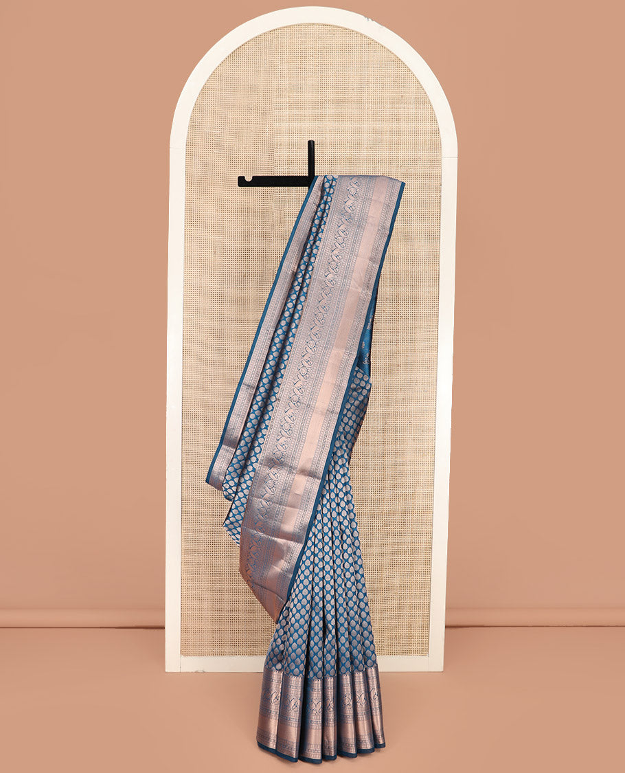 Blue Kanchipuram Wedding Silk Saree Gracefully Embellished with Zari Buttas, Highlighted with Zari Border of Thilakam, Star Vanki, Yaanai, and Round Mayil Designs, Majestically Zari-Woven Pallu, and Paired with a Matching Blouse