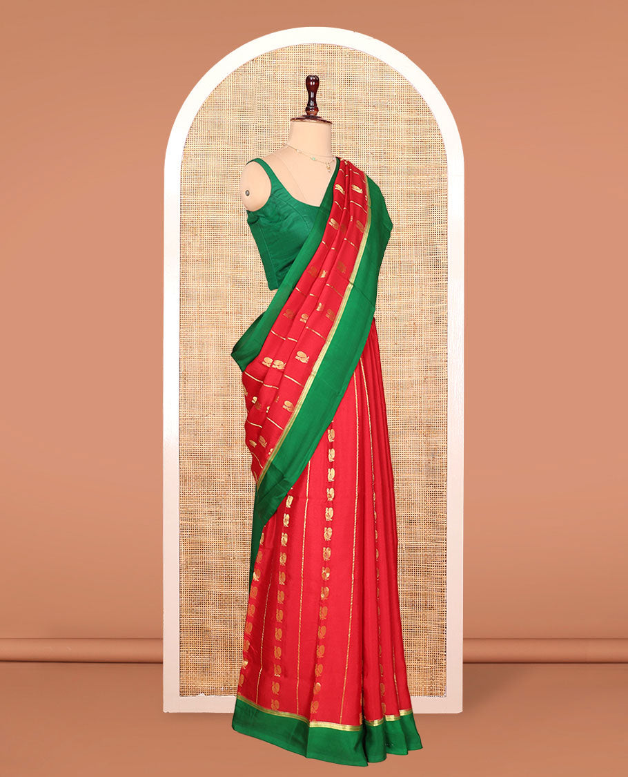 Red Mysore Silk Saree, Gracefully Adorned with Peacock Buttas and Stripes Across Its Body, Complemented by Contrast Border, Pallu Steeped with Traditional Zari Designs, and Paired with a Contrast Blouse