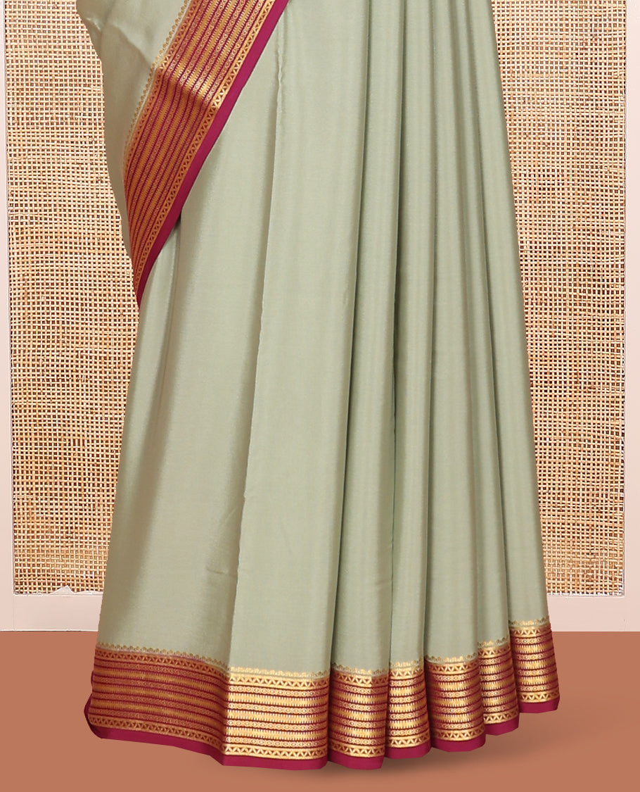Green Plain Mysore Silk Saree Complemented by Captivating Contrast Traditional Zari Designs Woven Border, Gleaming Zari Striped Pallu and Paired with a Contrast Blouse