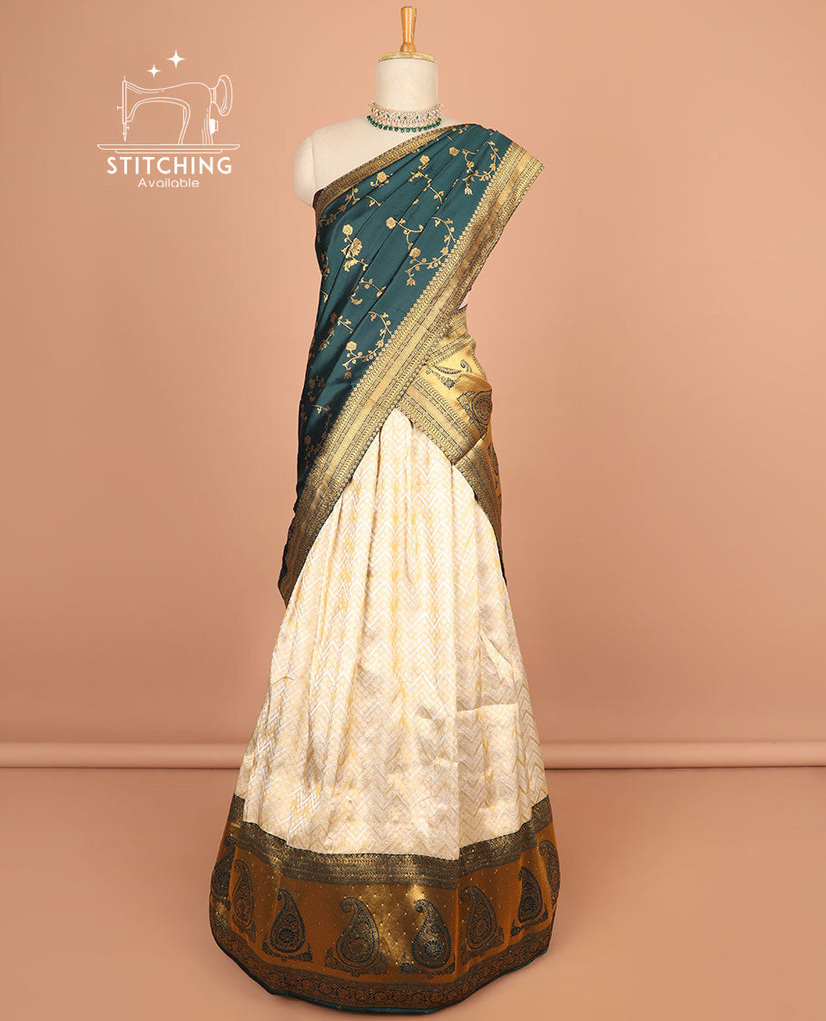 Cream buttas half saree with contrast zari design border, zari design blouse & bottle green floral vine zari design dhavani