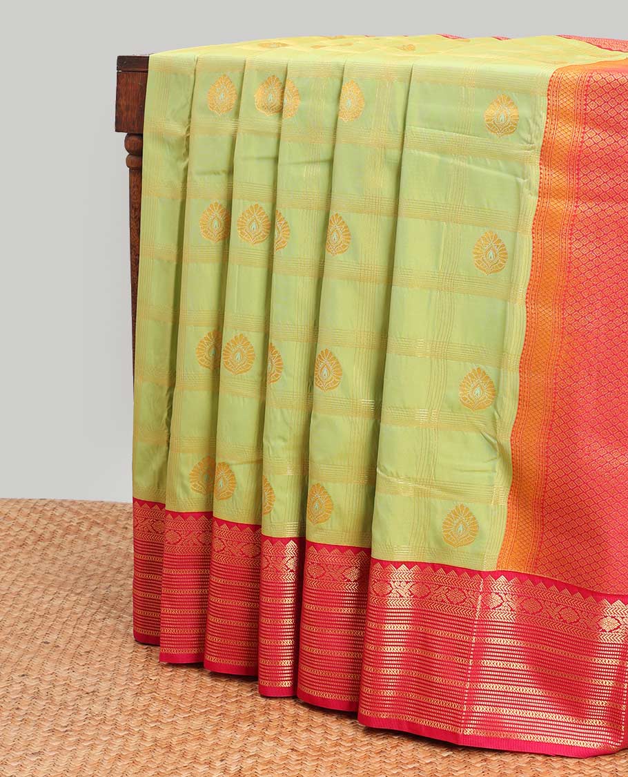 Green leaf motifs enclosed checked design gift saree with contrast zari design border & checked zari design pallu