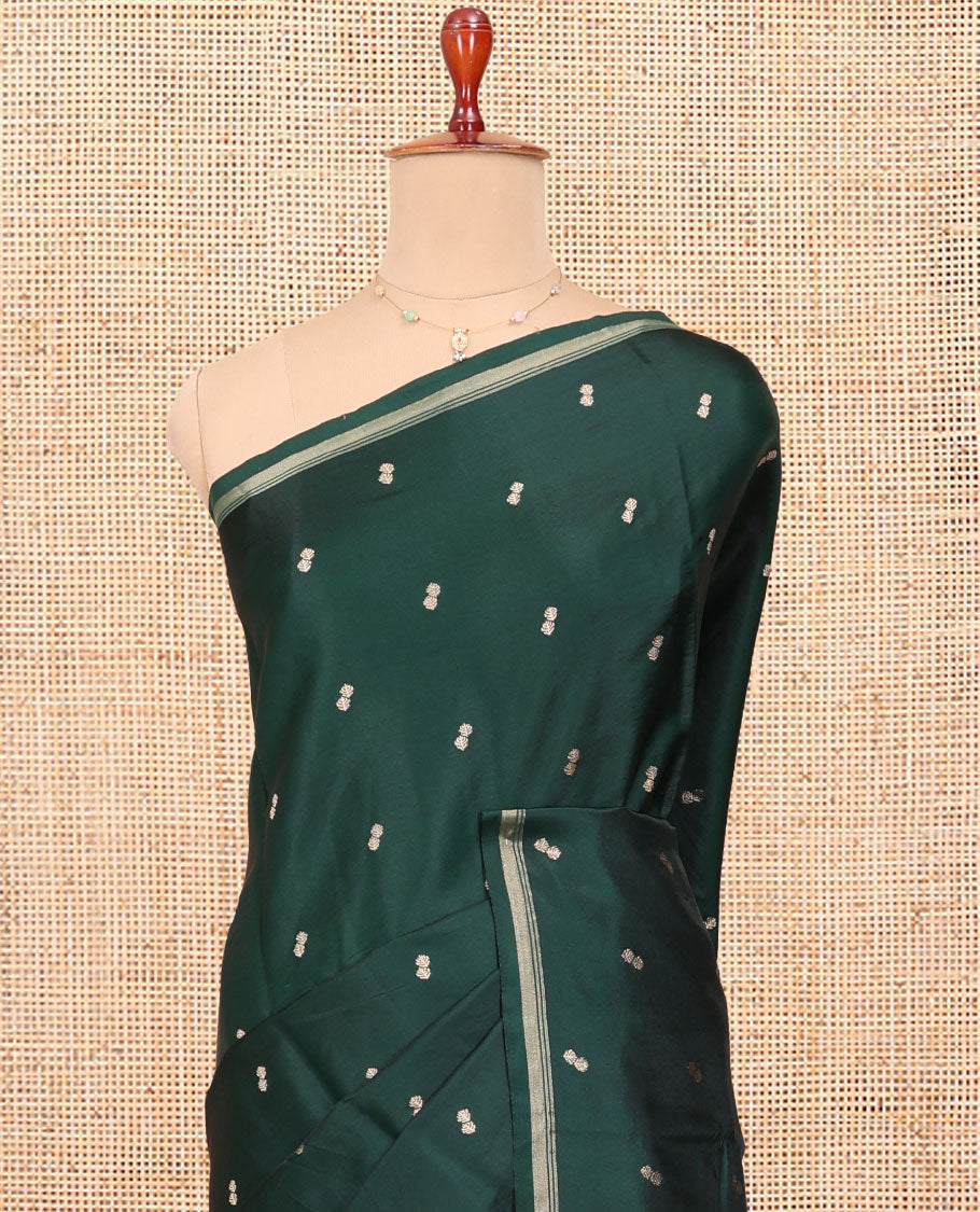 Bottle Green Satin Silk Saree, Enriched with Buttas All Over Its Body, a Subtle Piping Border, Complemented by a Contrast Pallu of Floral-Paisley Designs in Zari, and Paired with a Contrast Blouse