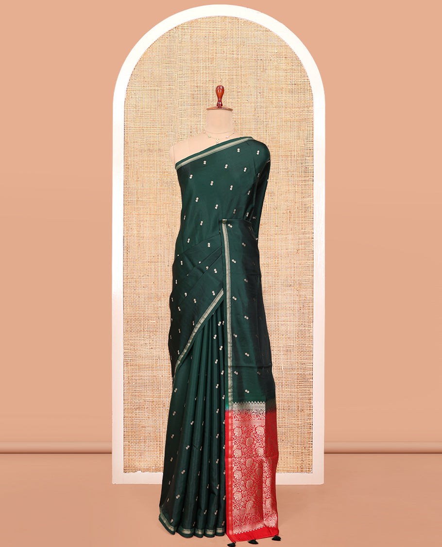 Bottle Green Satin Silk Saree, Enriched with Buttas All Over Its Body, a Subtle Piping Border, Complemented by a Contrast Pallu of Floral-Paisley Designs in Zari, and Paired with a Contrast Blouse