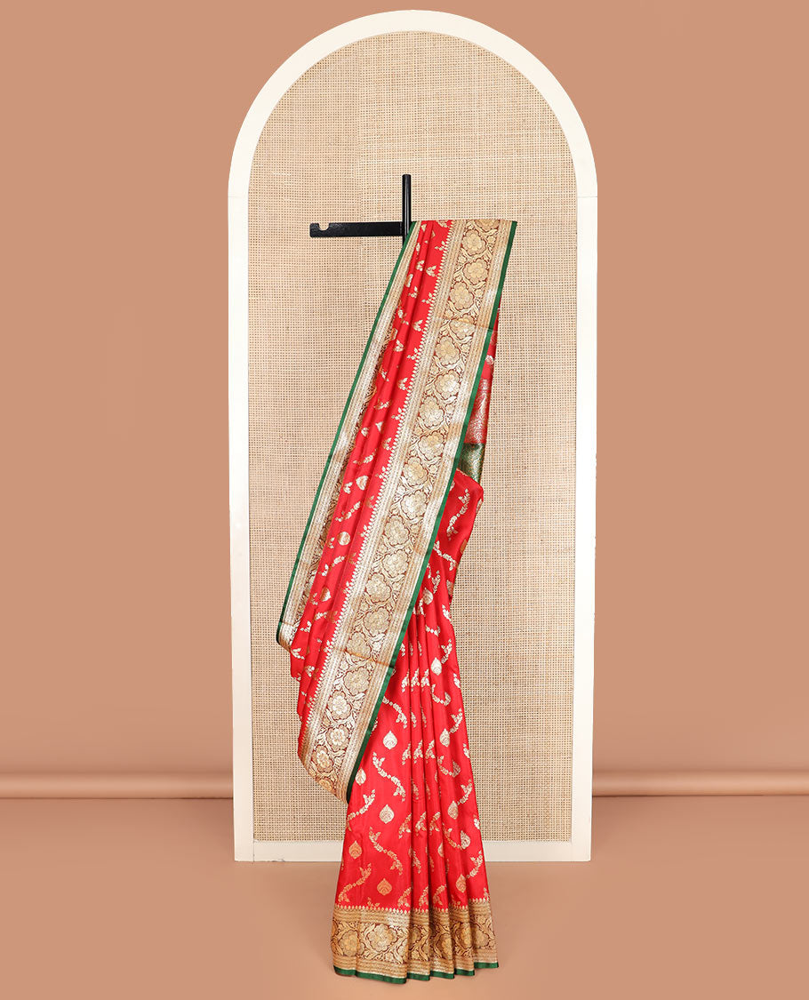 Red zari buttas and leaf vine banarasi silk saree, contrast floral creeper design border, and intricately patterned pallu