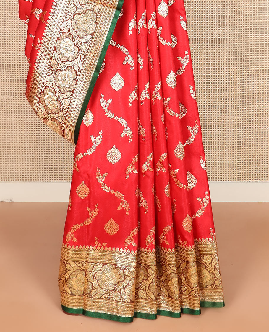 Red zari buttas and leaf vine banarasi silk saree, contrast floral creeper design border, and intricately patterned pallu
