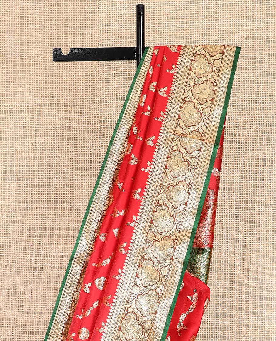 Red zari buttas and leaf vine banarasi silk saree, contrast floral creeper design border, and intricately patterned pallu