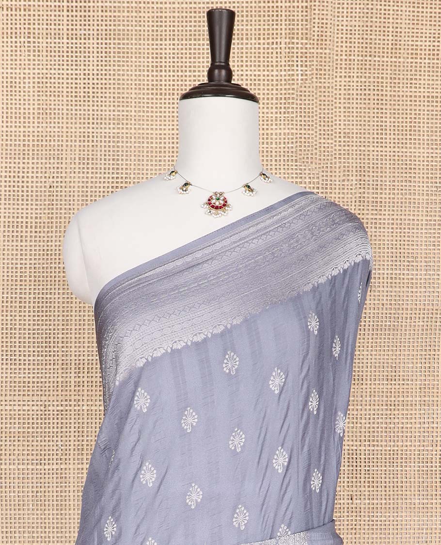 Grey floral motifs fancy crepe saree with self intricate zari design border & floral design pallu