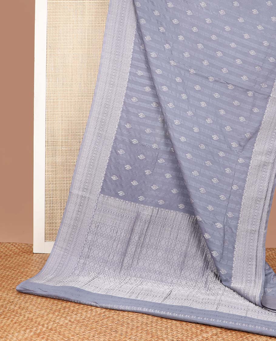 Grey floral motifs fancy crepe saree with self intricate zari design border & floral design pallu