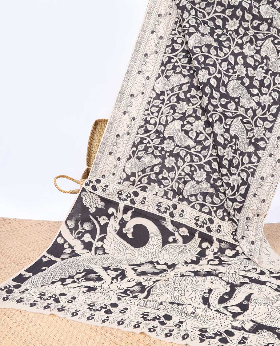 Black floral machine printed kalamkari cotton saree, self-border & animal motifs printed border
