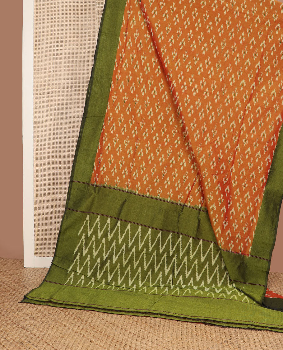 Orange buttas ikkat cotton saree, contrast plain border & pallu of ikkat chevron design
