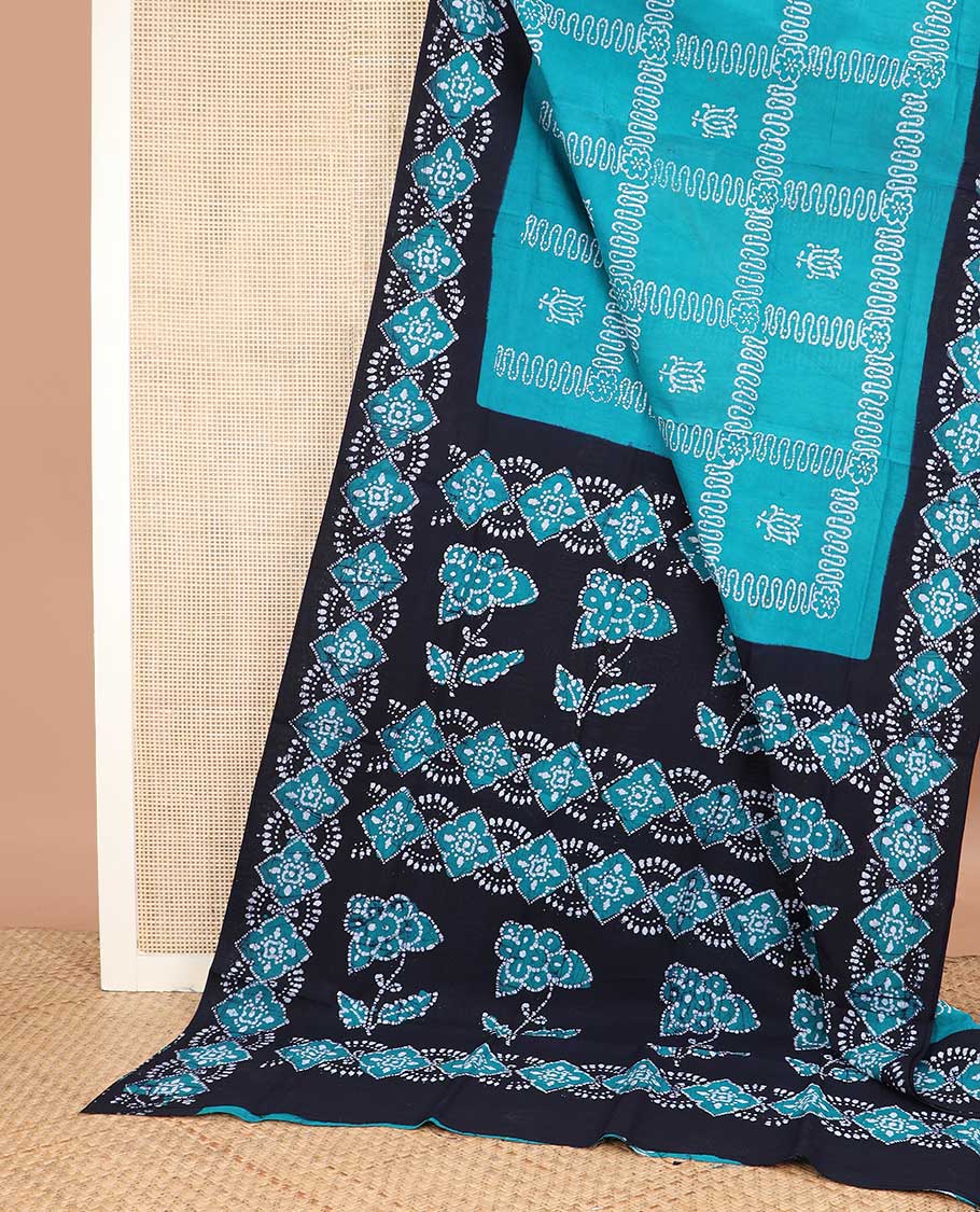 Blue batik-style floral, and checked sungudi cotton saree, contrast floral printed border, and paisley batik printed pallu