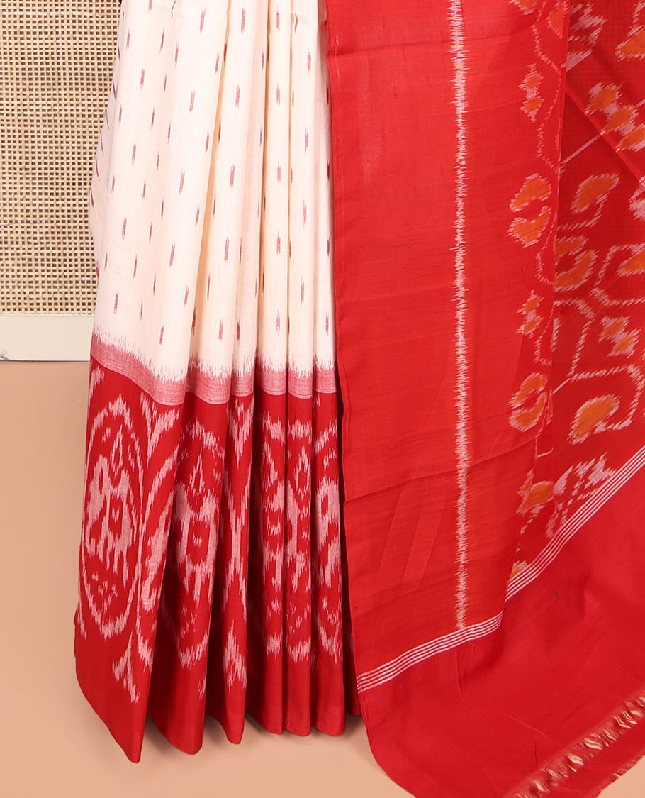 Cream Ikkat Cotton Saree, Features Ikkat Buttas All Over Its Body, Complemented by a Contrast Ikkat-Style Round Elephant Border, Intricately Designed Pallu, and Has No Blouse