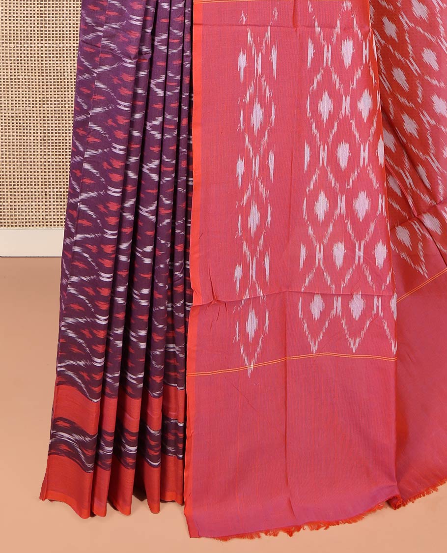 Purple Ikkat Cotton Saree, Adorned with Ikkat-Style Ogee Patterns on Its Body, Complemented by Contrast Ikkat-Textured Border, Pallu Steeped with Ikkat Ogee Patterns, and Has No Blouse