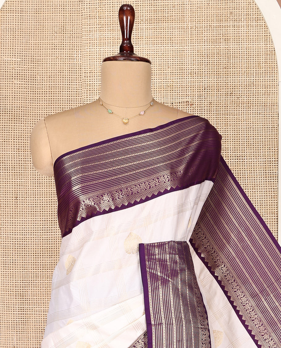 Off-White and Purple Budget Silk Saree, Bedecked with Zari Butta Enclosed Checks on Its Body, Complemented by a Contrast Traditional Zari Design Border of Paisleys, Grand Jaal Pallu, and Paired with a Contrast Blouse