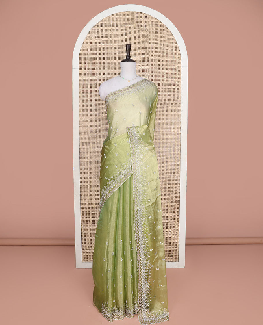 Green Designer Saree, Gleamed Up with Stone Embroidered Buttas on Its Body, Highlighted by Scallop Stone Work Border, Pallu of Stone Work, and Paired with a Heavily Stone Embellished Matching Blouse