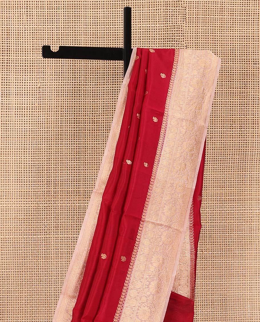 Red Raw Mango Silk Saree Decorated with Buttas, Featuring a Contrast Floral Creeper Zari-Designed Border, a Pallu Adorned with Chevron Zari Designs, Paired with a Contrast Blouse