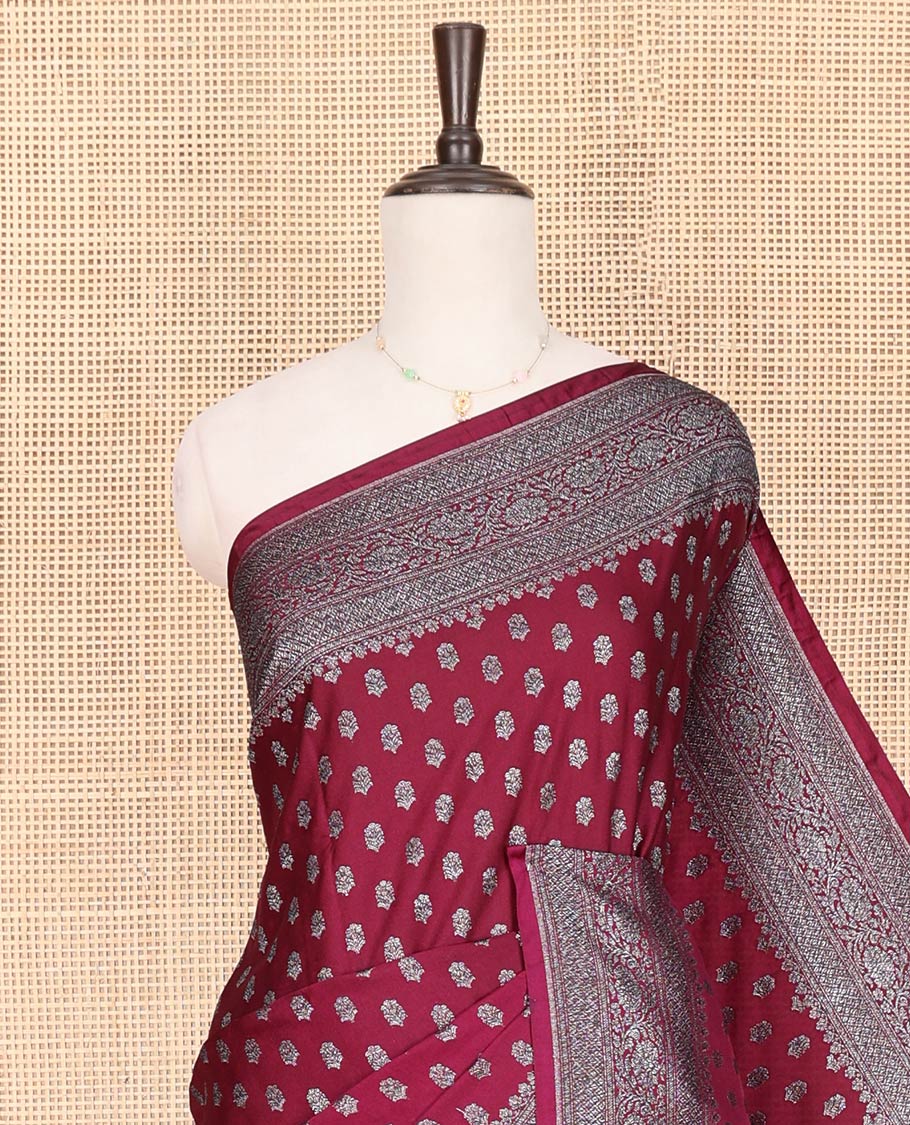 Maroon Fancy Georgette Saree Richly Detailed with Zari Buttas, Highlighted by a Traditional Zari Design Border, Grandly Woven Pallu Featuring Floral Jaal Zari Designs, and Paired with a Matching Blouse