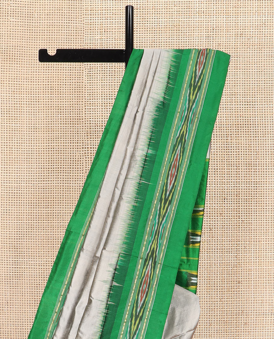 Grey Plain Ikkat Silk Saree with a Contrast Green Border Decked with a Hazy Ikkat Weave, Featuring a Pallu Flanked by Stripes and Ikkat Texture
